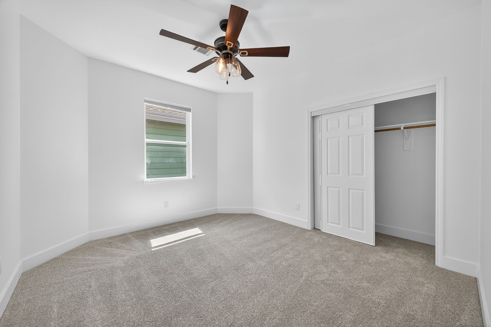 714 Zoe Street Houston, TX 77020 - Photo 31 of 34 a view of a livingroom with a ceiling fan & windows