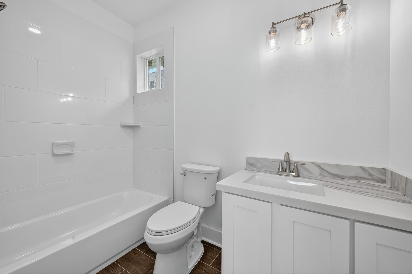 714 Zoe Street Houston, TX 77020 - Photo 33 of 34 a bathroom with a sink toilet and shower