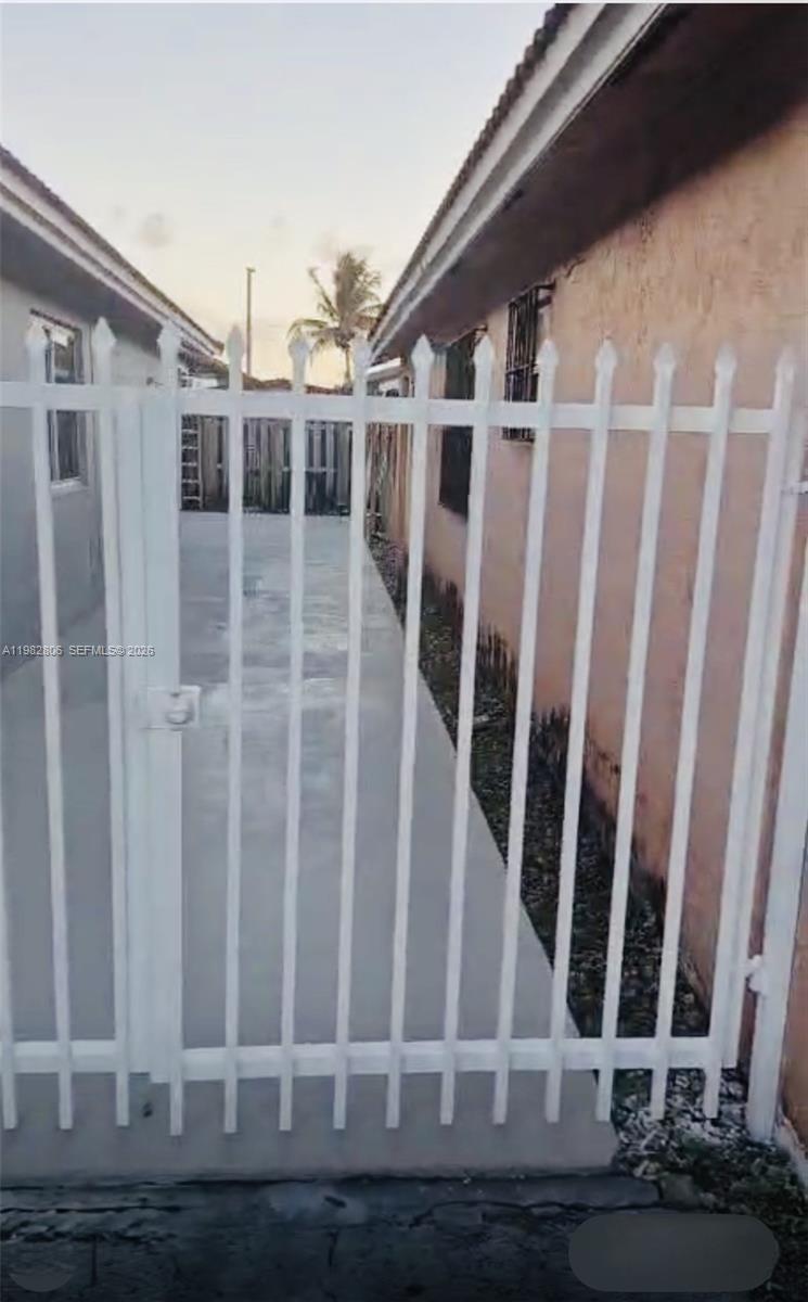 3355 West 68th Street, Unit 119 Hialeah, FL 33018 - Photo 3 of 11 a view of wooden door with staircase