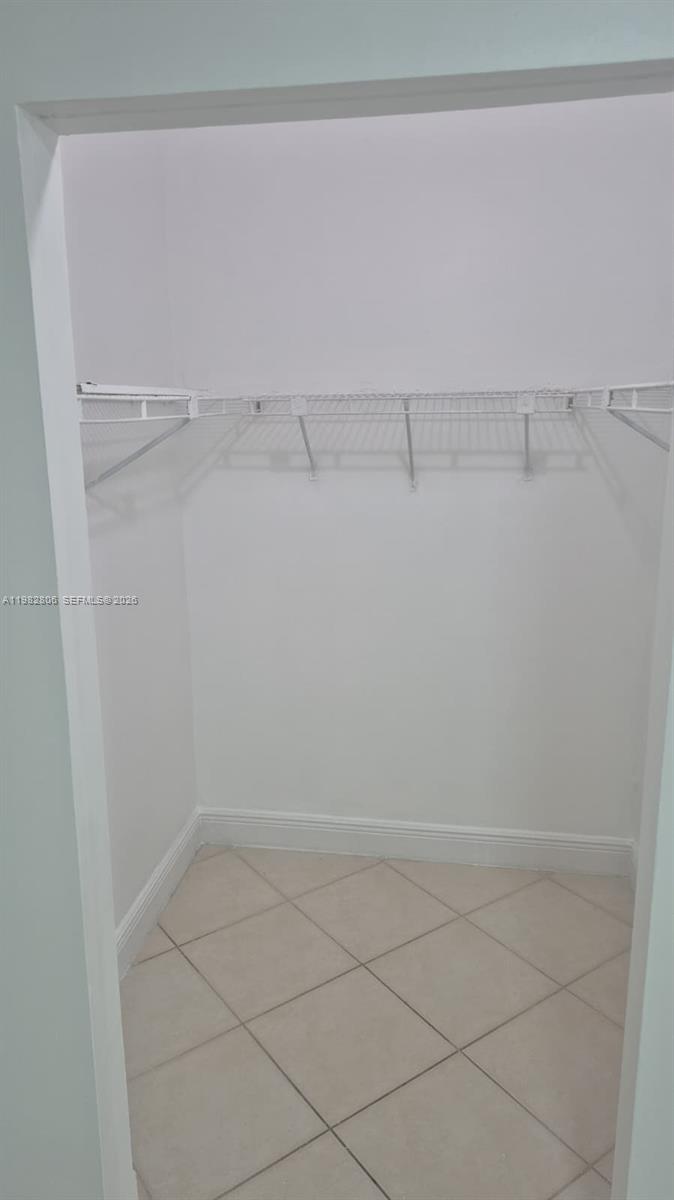 3355 West 68th Street, Unit 119 Hialeah, FL 33018 - Photo 8 of 11 a view of a room with racks on the wall