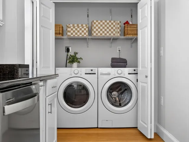 a utility room with sink dryer and washer