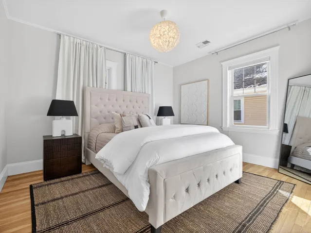a bathroom with a sink a toilet and shower curtain