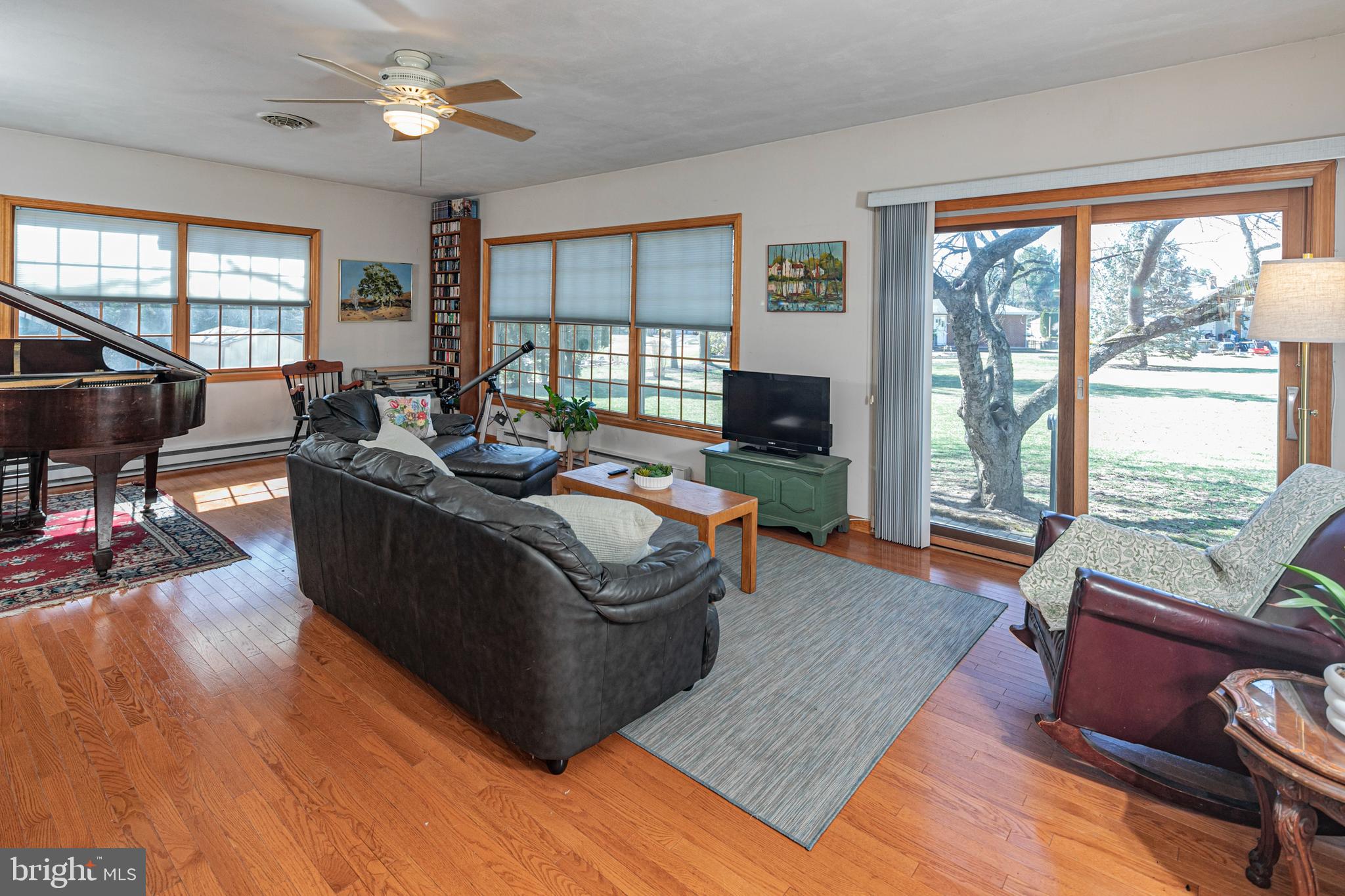 110 Johnstone Drive Pennington, NJ 08534 - Photo 11 of 31 a living room with furniture floor to ceiling window and wooden floor