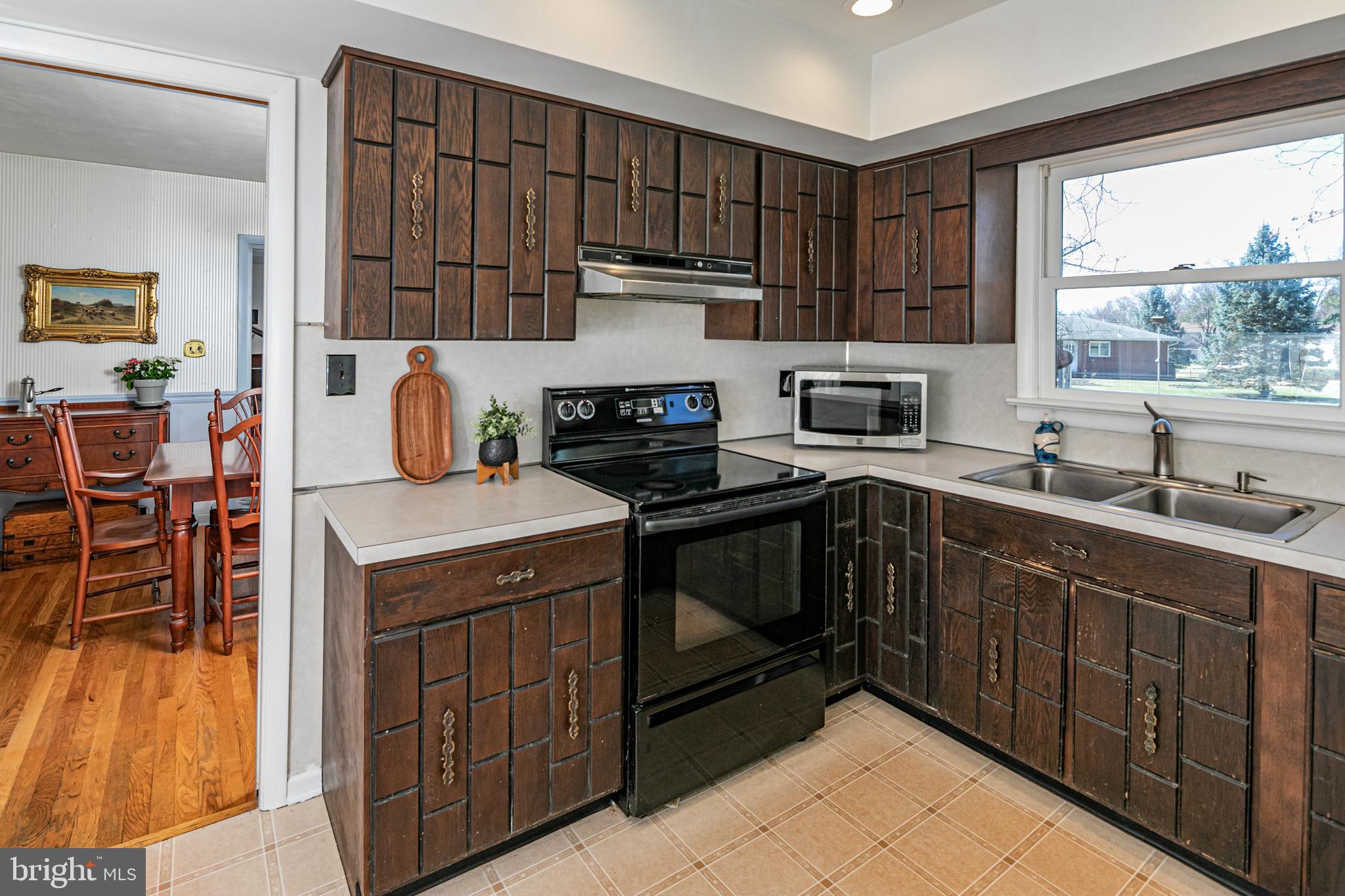 110 Johnstone Drive Pennington, NJ 08534 - Photo 15 of 31 a kitchen with a sink a stove and cabinets