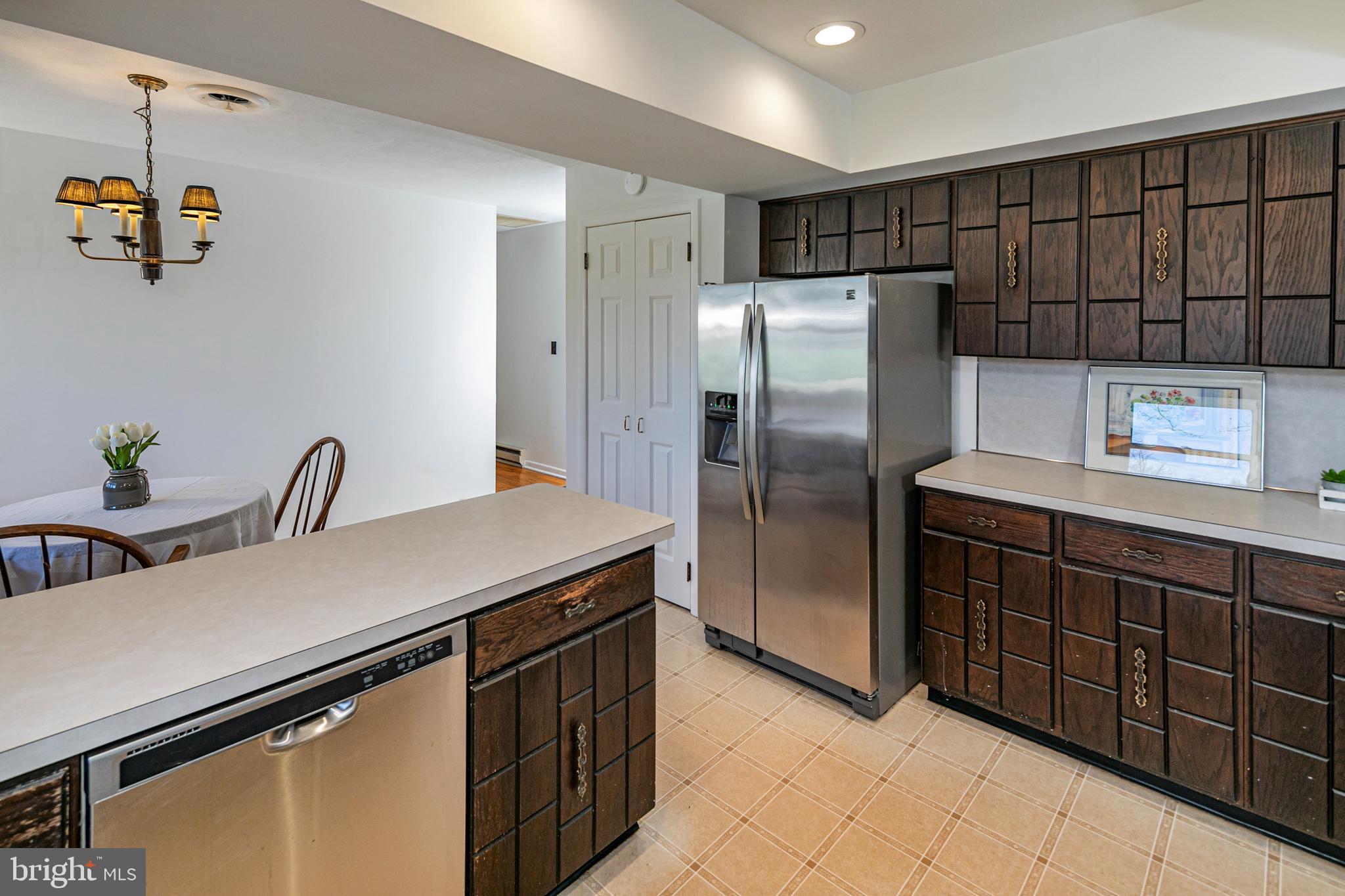 110 Johnstone Drive Pennington, NJ 08534 - Photo 16 of 31 a kitchen with a refrigerator and a sink