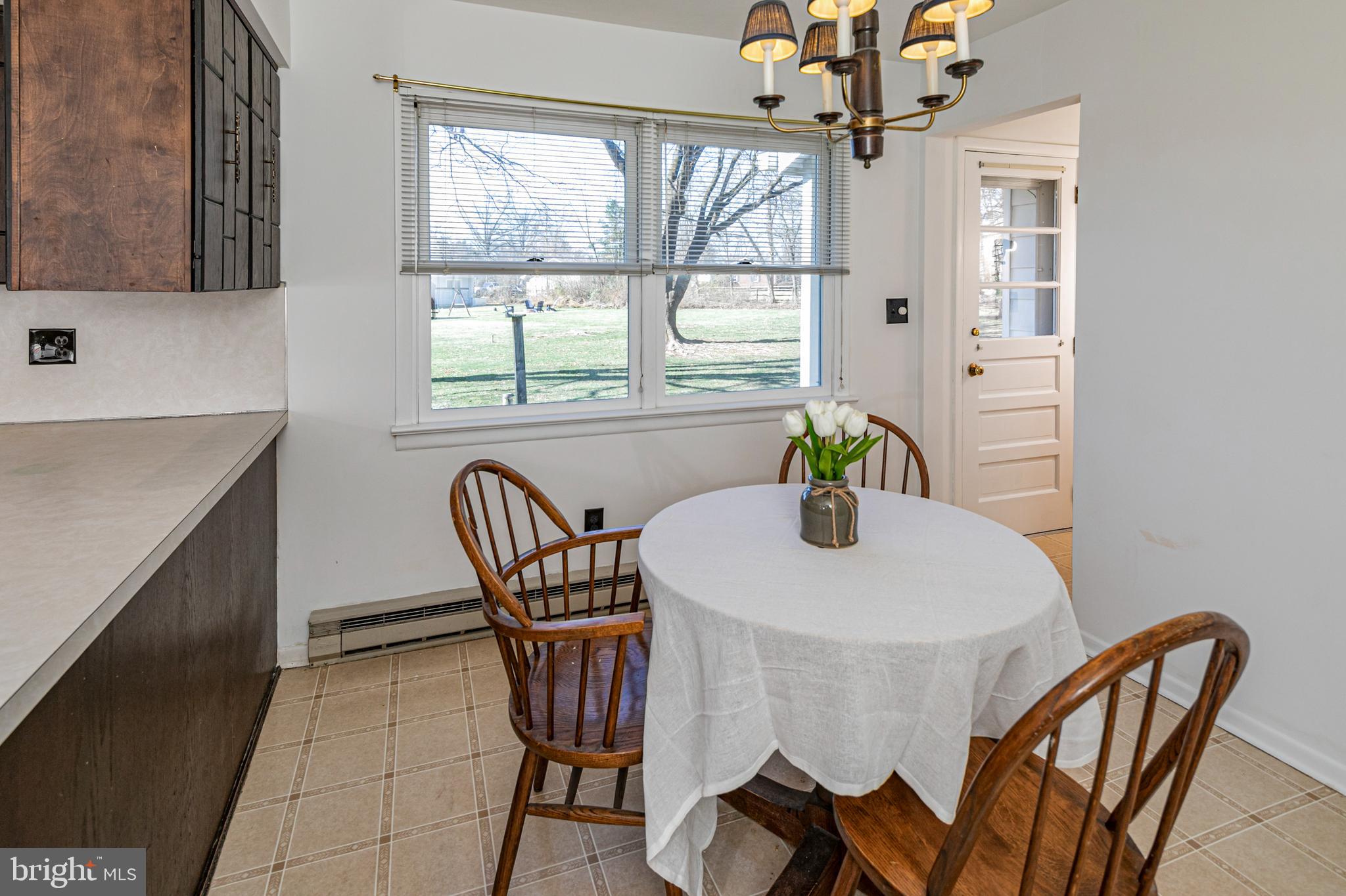 110 Johnstone Drive Pennington, NJ 08534 - Photo 18 of 31 a dining room with furniture a chandelier and window