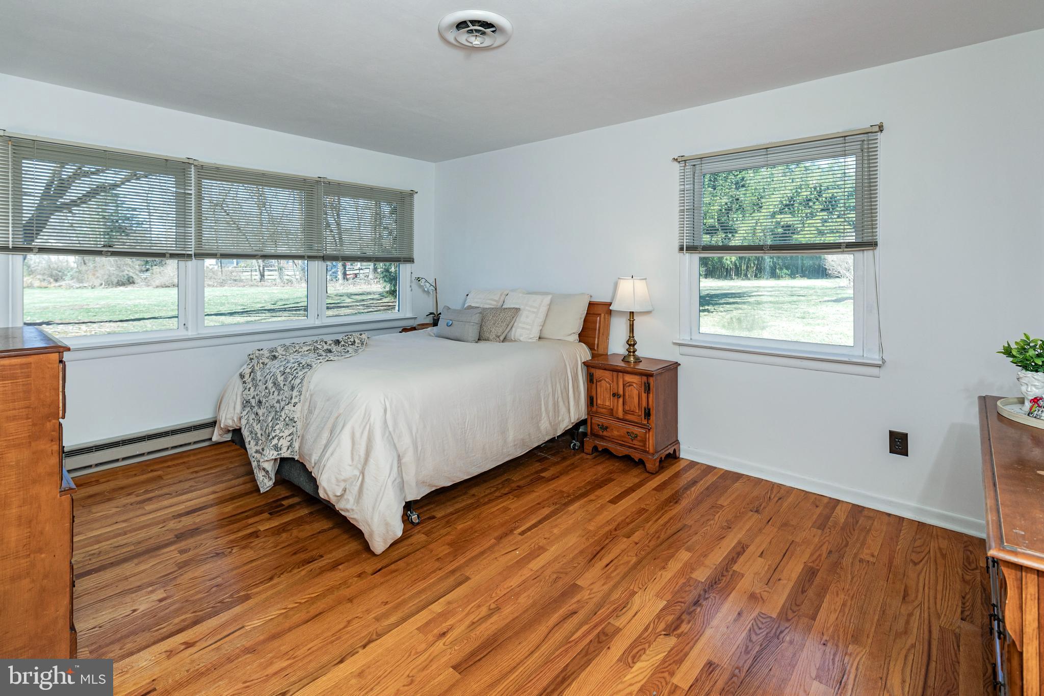 110 Johnstone Drive Pennington, NJ 08534 - Photo 19 of 31 a bed sitting in a bedroom next to a window