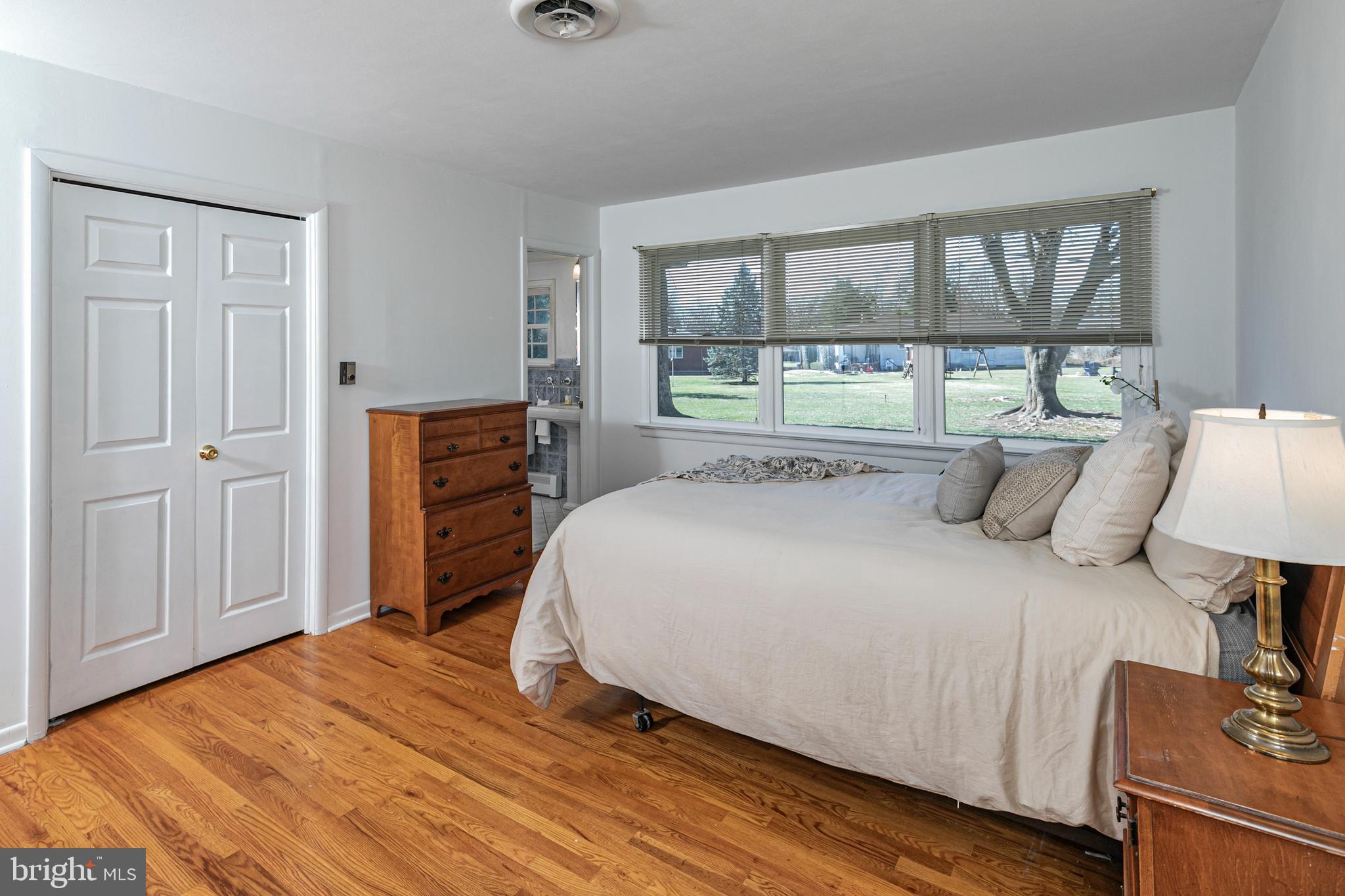 110 Johnstone Drive Pennington, NJ 08534 - Photo 20 of 31 a bedroom with a bed and wooden floor