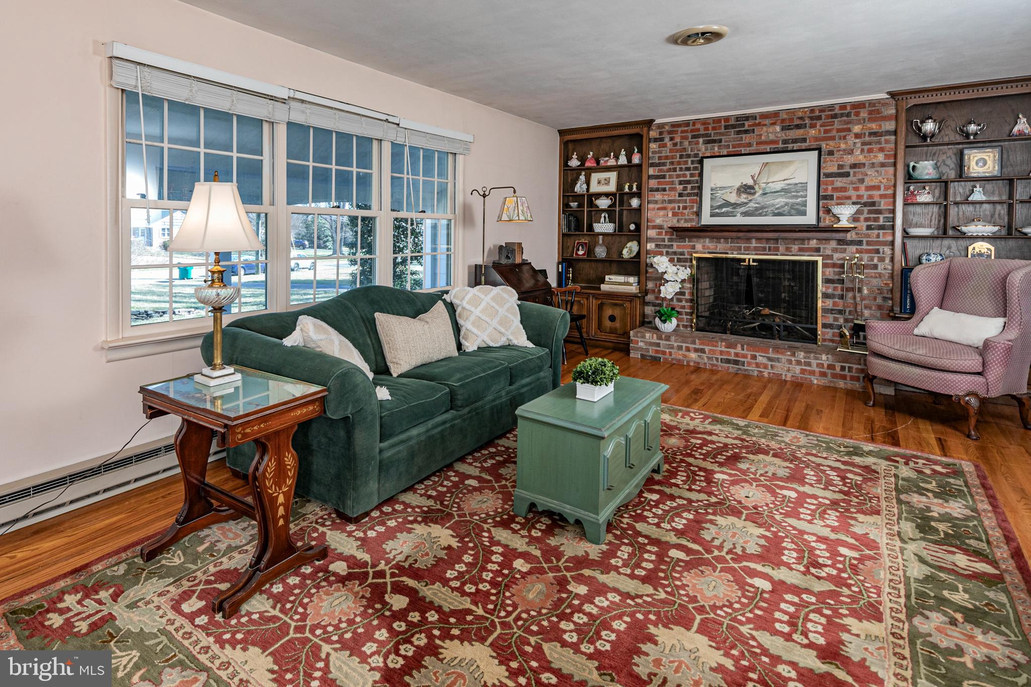 110 Johnstone Drive Pennington, NJ 08534 - Photo 6 of 31 a living room with furniture a window and a fireplace