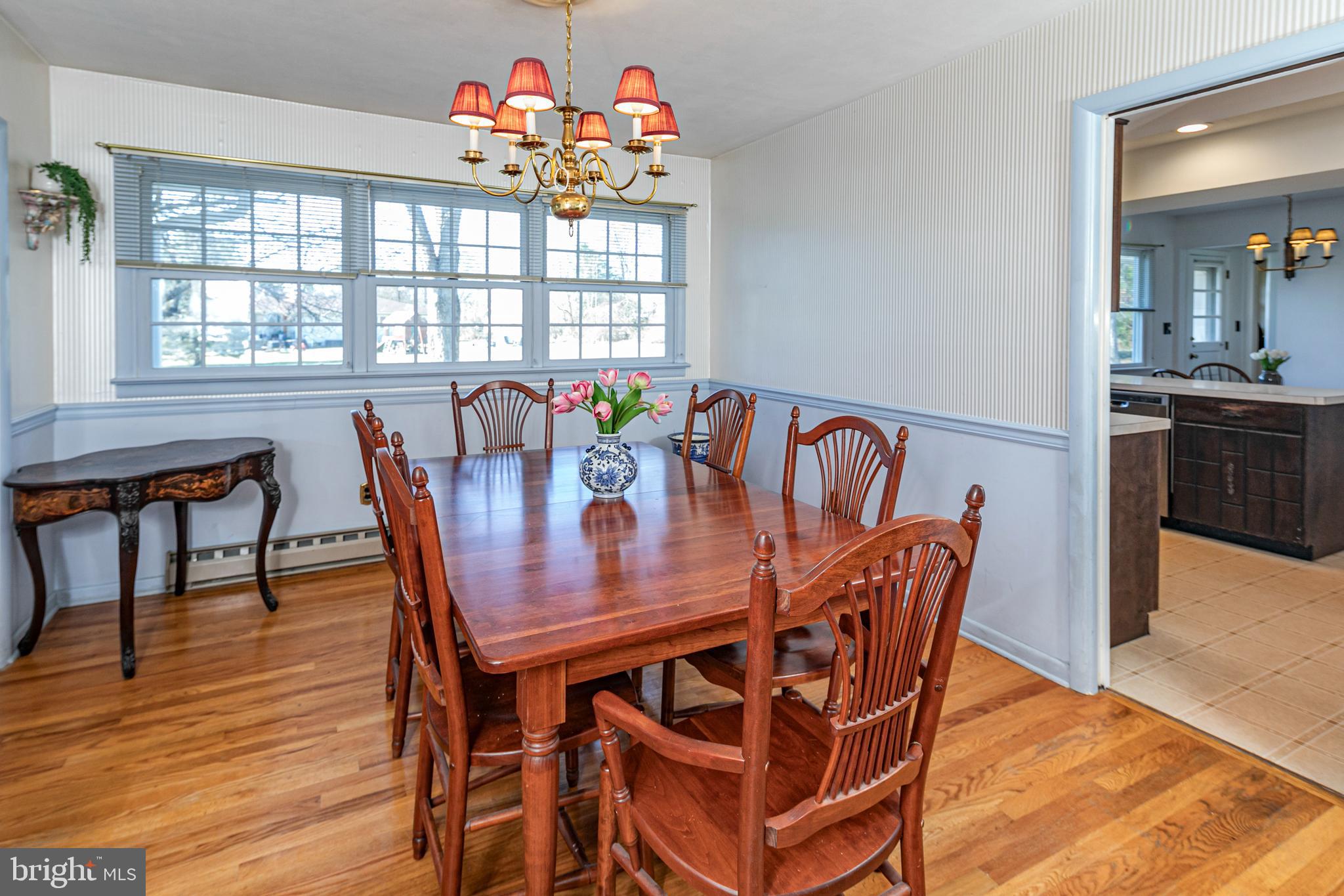 110 Johnstone Drive Pennington, NJ 08534 - Photo 8 of 31 a view of a dining room with furniture a chandelier and wooden floor