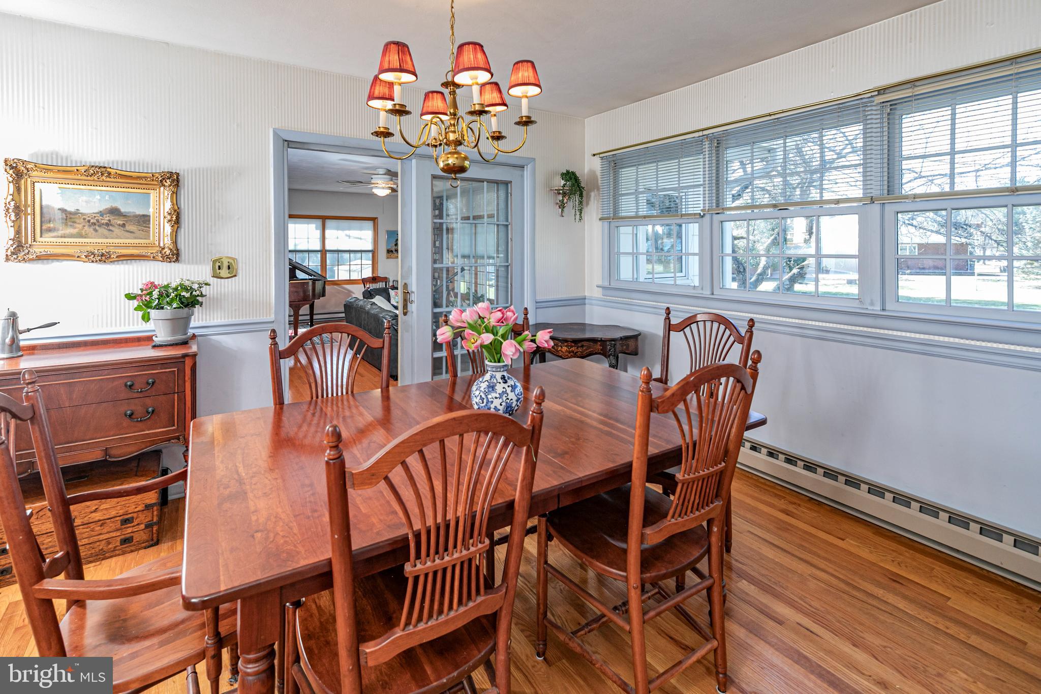 110 Johnstone Drive Pennington, NJ 08534 - Photo 9 of 31 a view of a dining room with furniture a chandelier and wooden floor
