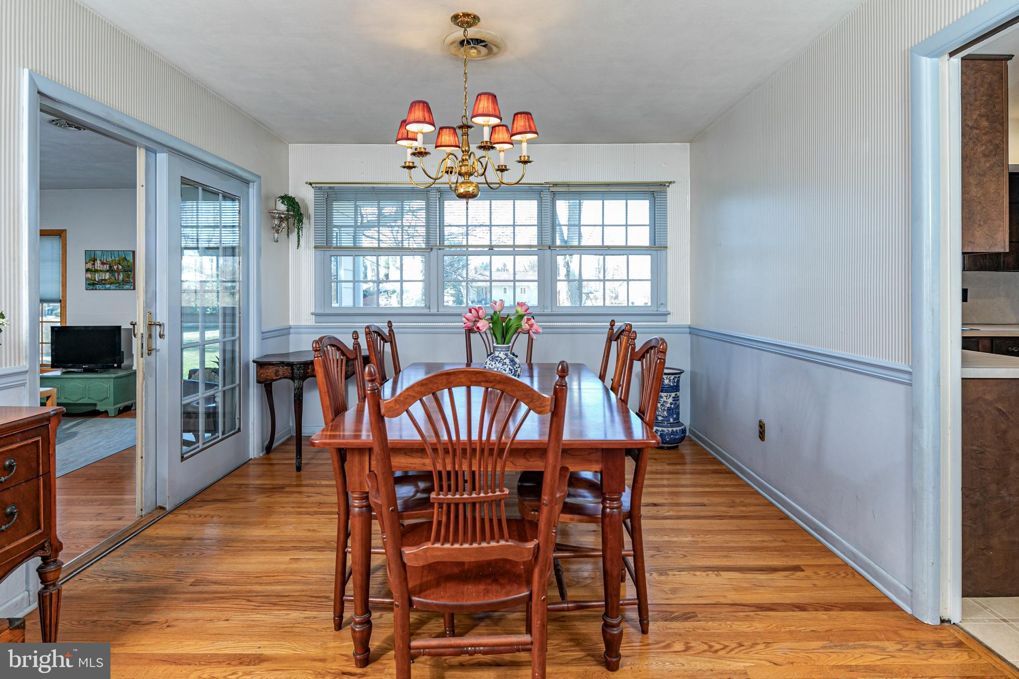110 Johnstone Drive Pennington, NJ 08534 - Photo 10 of 31 a view of a dining room with furniture a chandelier and wooden floor