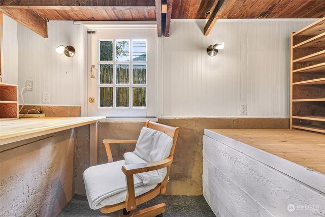 a bathroom with a granite countertop sink and a bathtub