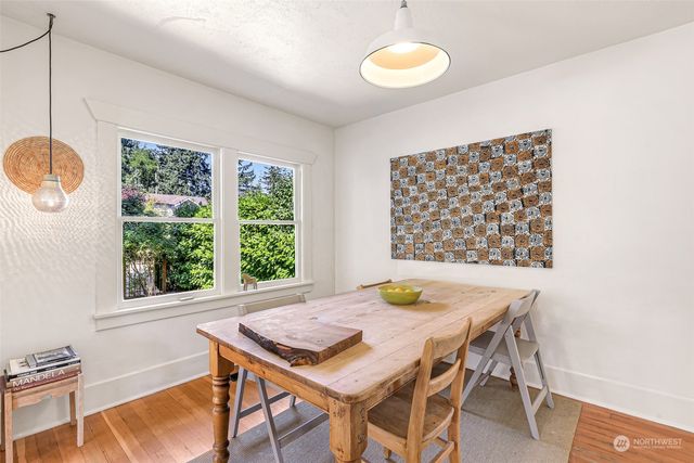 a view of a dining room with furniture and window