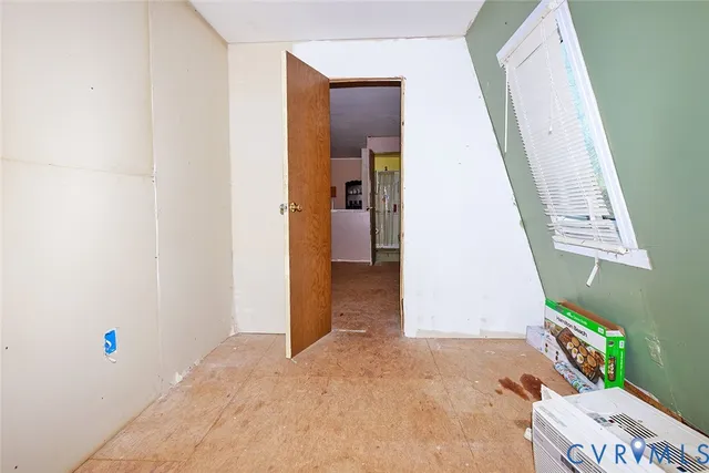 a living room with furniture a window and a chandelier