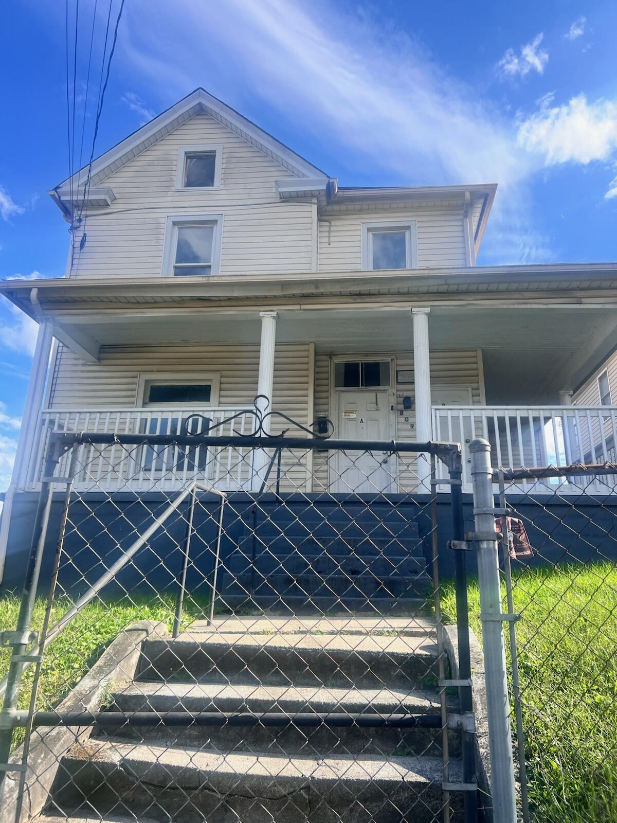 809 Jamison Avenue Southeast Roanoke, VA 24013 - Photo 1 of 9 a view of house with backyard and seating space