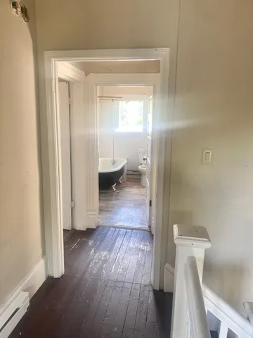 a bathroom with a sink toilet and a mirror