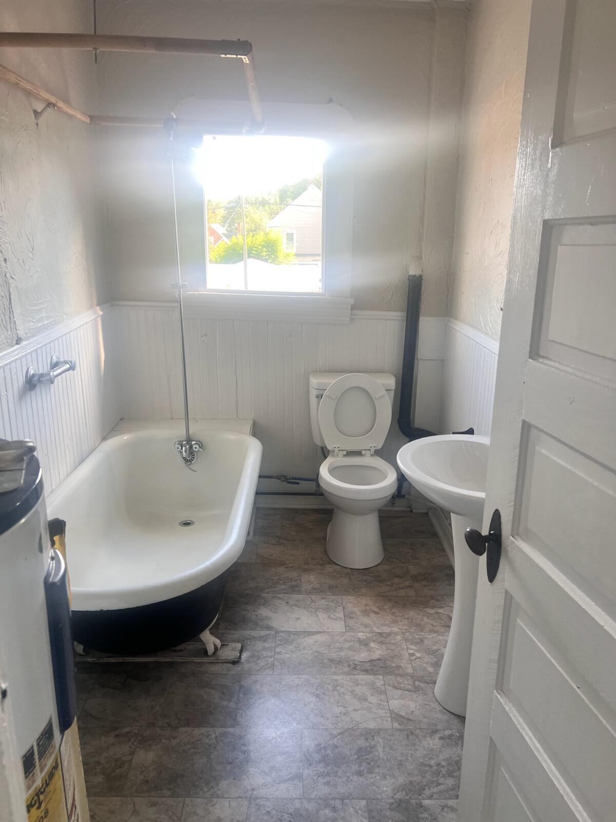 809 Jamison Avenue Southeast Roanoke, VA 24013 - Photo 9 of 9 a bathroom with a sink toilet and a mirror