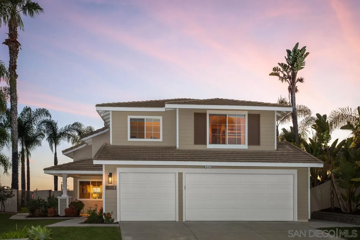 409 Helix Way Oceanside, CA 92057 - Photo 1 of 29 a front view of a house with a yard and palm trees