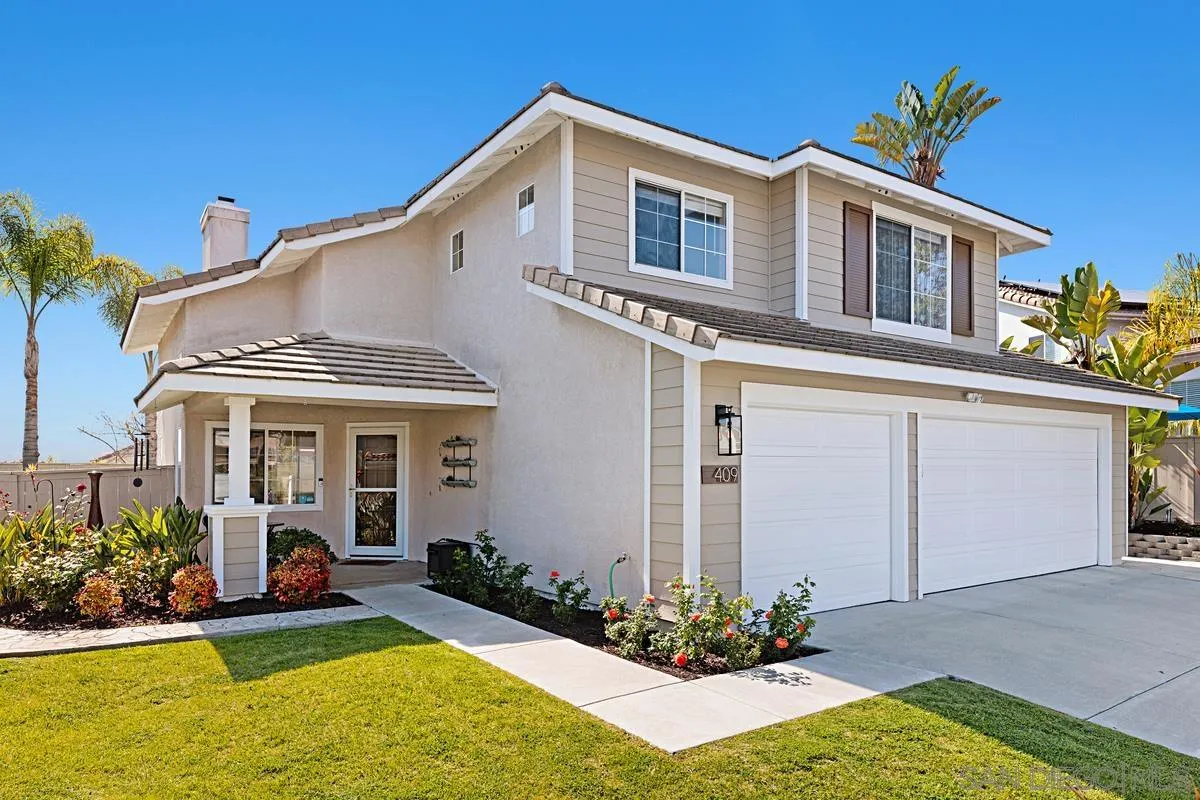 409 Helix Way Oceanside, CA 92057 - Photo 2 of 29 a front view of a house with a yard and porch