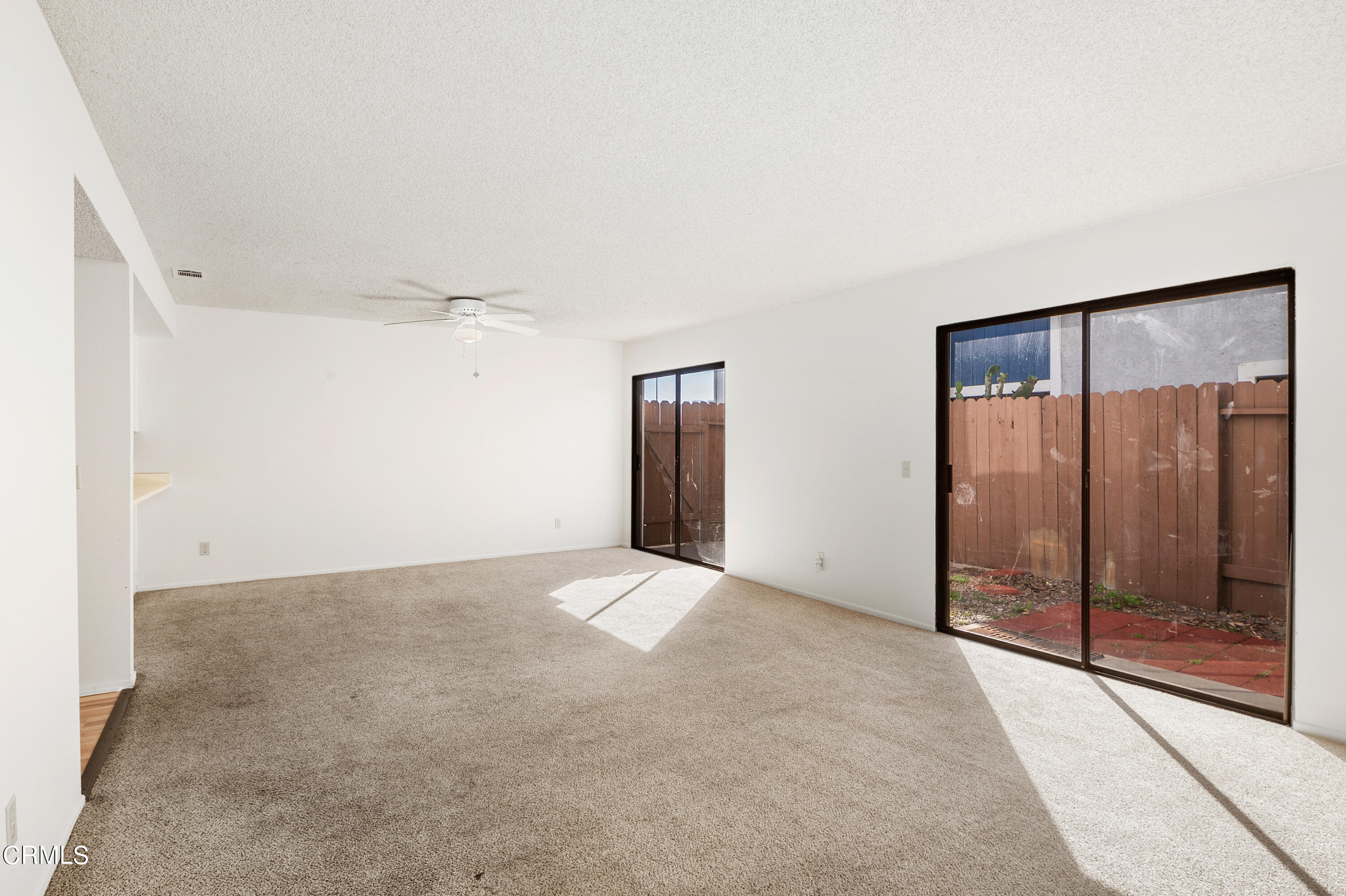 5202 Longfellow Way Oxnard, CA 93033 - Photo 4 of 21 a view of an empty room with glass door