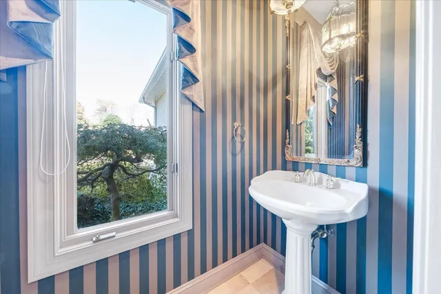 wooden floor fireplace and windows in a room