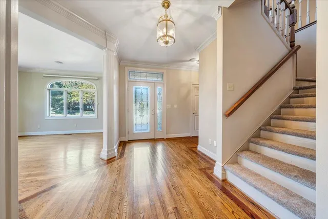 a view of wooden floor and windows in a room