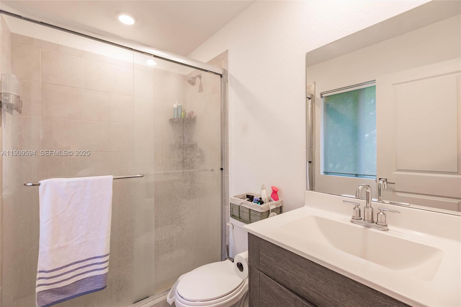 2333 Southeast 10th Street Homestead, FL 33035 - Photo 11 of 22 a bathroom with a sink toilet and shower