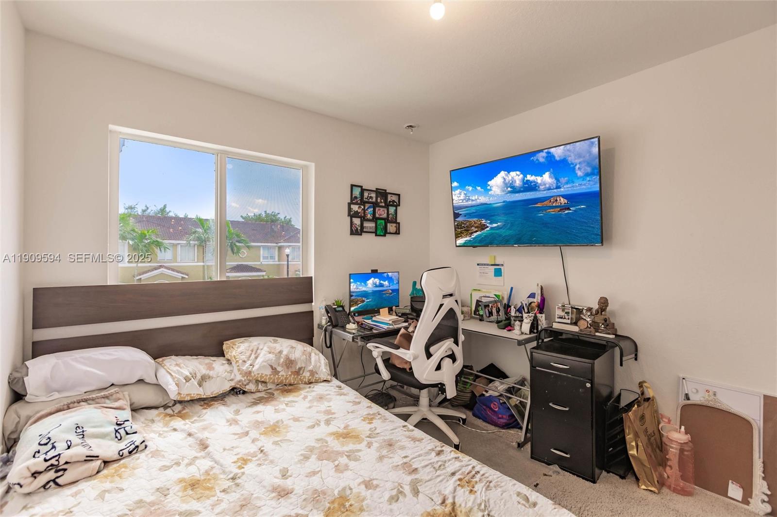 2333 Southeast 10th Street Homestead, FL 33035 - Photo 12 of 22 a bedroom with a bed and a flat screen tv