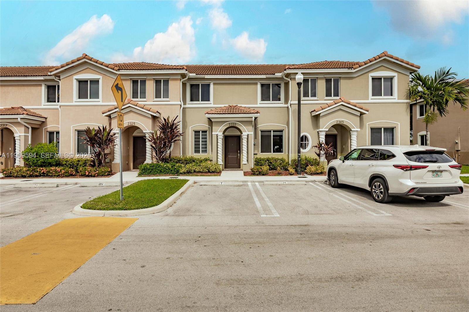 2333 Southeast 10th Street Homestead, FL 33035 - Photo 16 of 22 a view of multiple houses with a yard