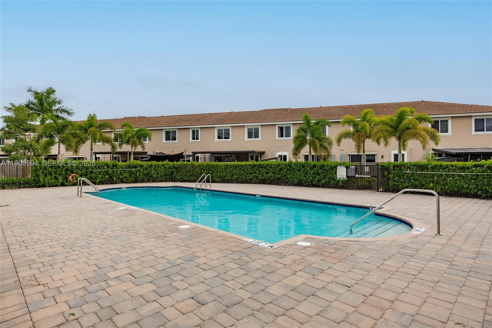 2333 Southeast 10th Street Homestead, FL 33035 - Photo 19 of 22 a view of swimming pool with outdoor seating and a yard