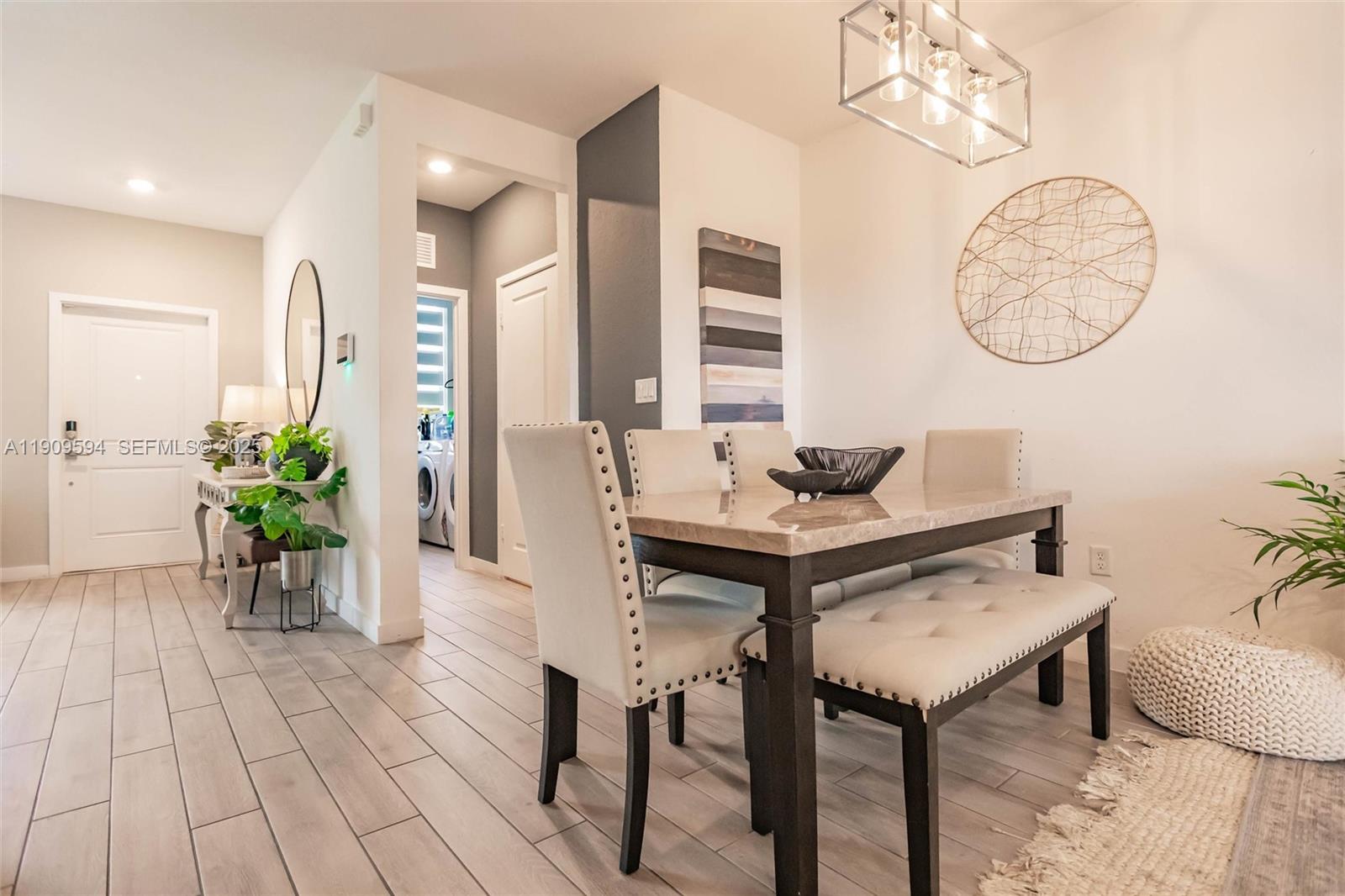 2333 Southeast 10th Street Homestead, FL 33035 - Photo 6 of 22 a view of a room that has a table and chairs