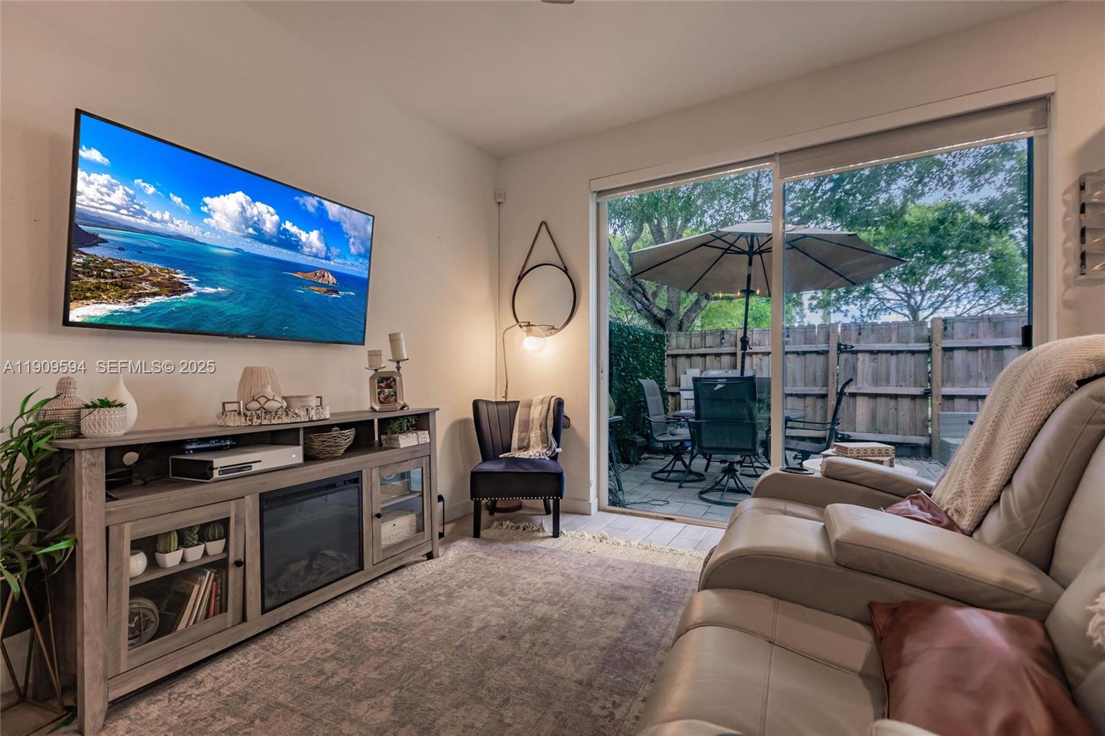 2333 Southeast 10th Street Homestead, FL 33035 - Photo 7 of 22 a view of a livingroom with furniture and a flat screen tv
