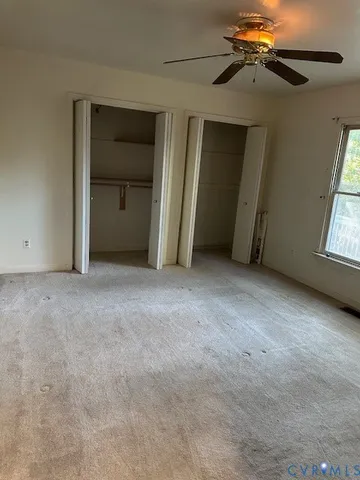 a large kitchen with granite countertop a sink and dishwasher a stove top oven with wooden floor