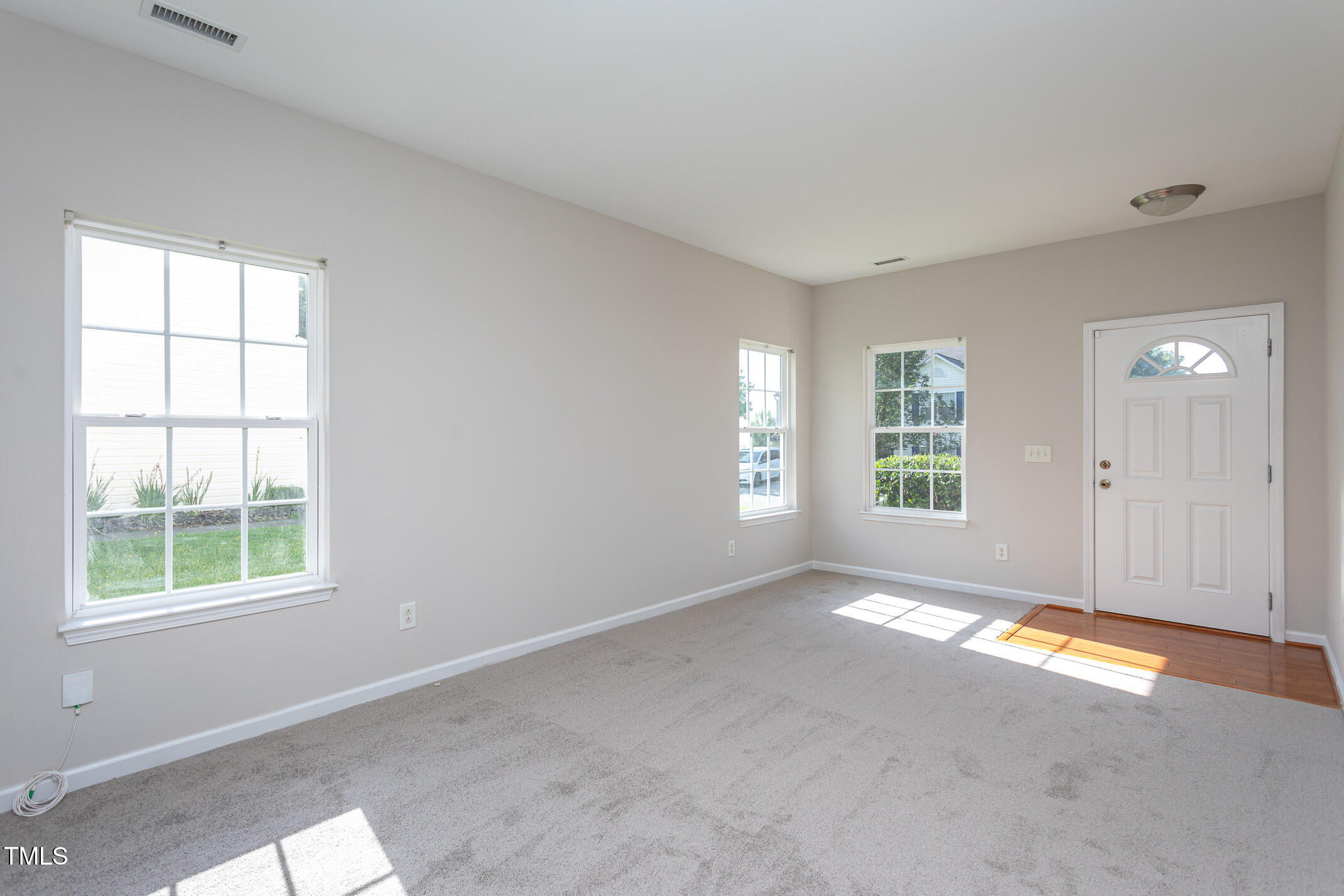 601 Weeping Willow Drive Durham, NC 27704 - Photo 11 of 36 a view of an empty room with a window