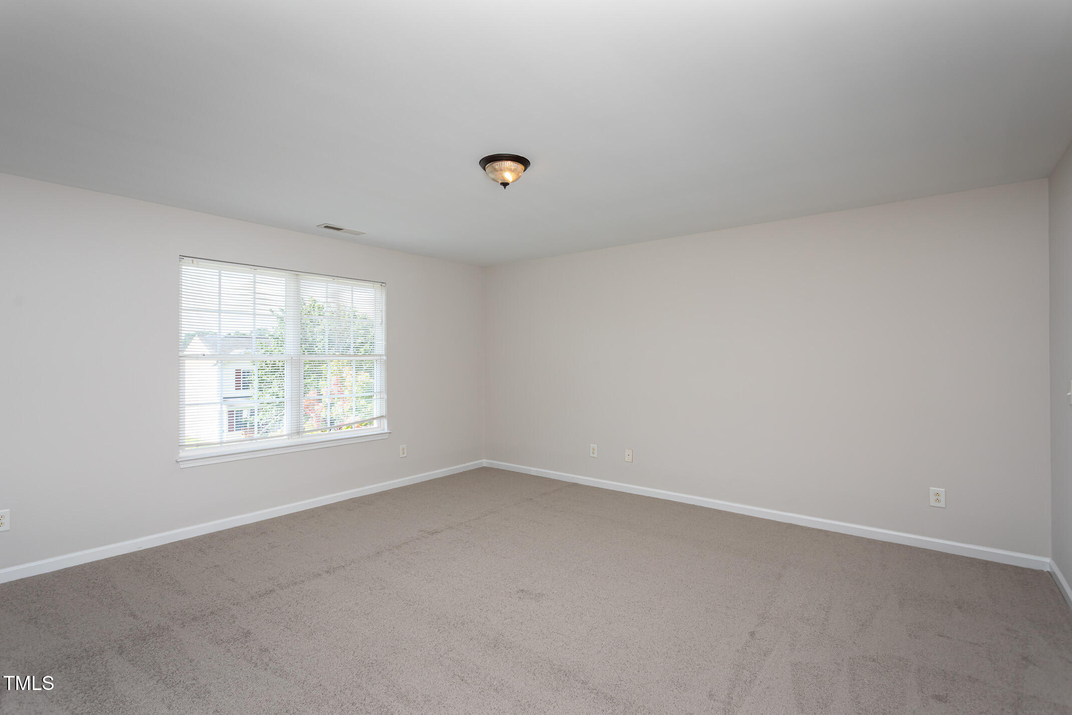 601 Weeping Willow Drive Durham, NC 27704 - Photo 16 of 36 an empty room with a window