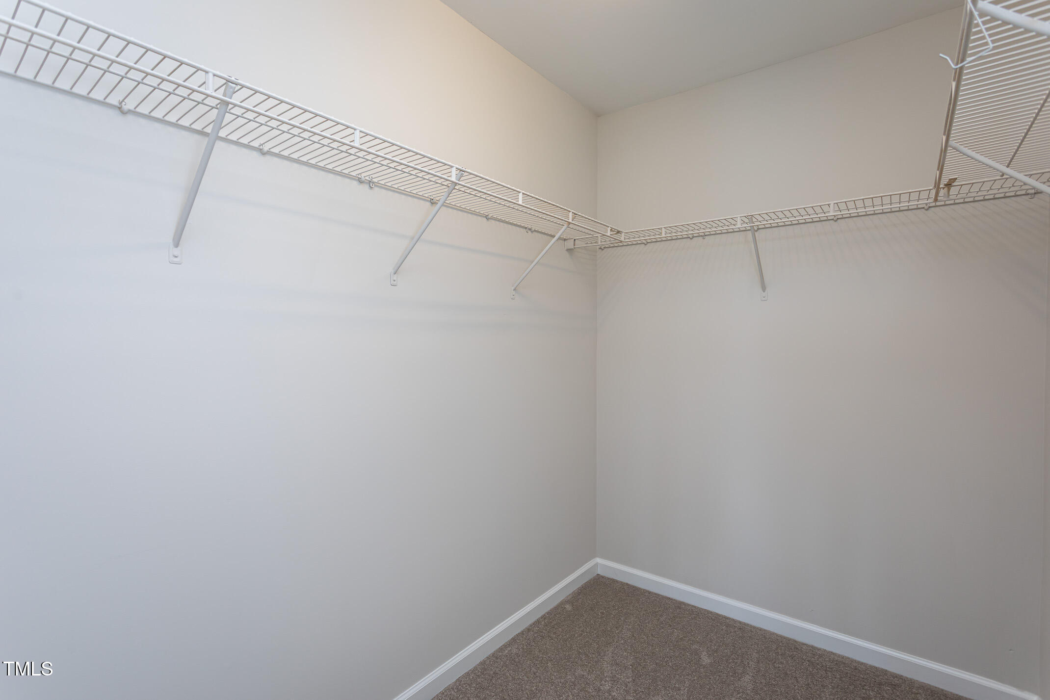 601 Weeping Willow Drive Durham, NC 27704 - Photo 25 of 36 a view of a room with racks on the wall