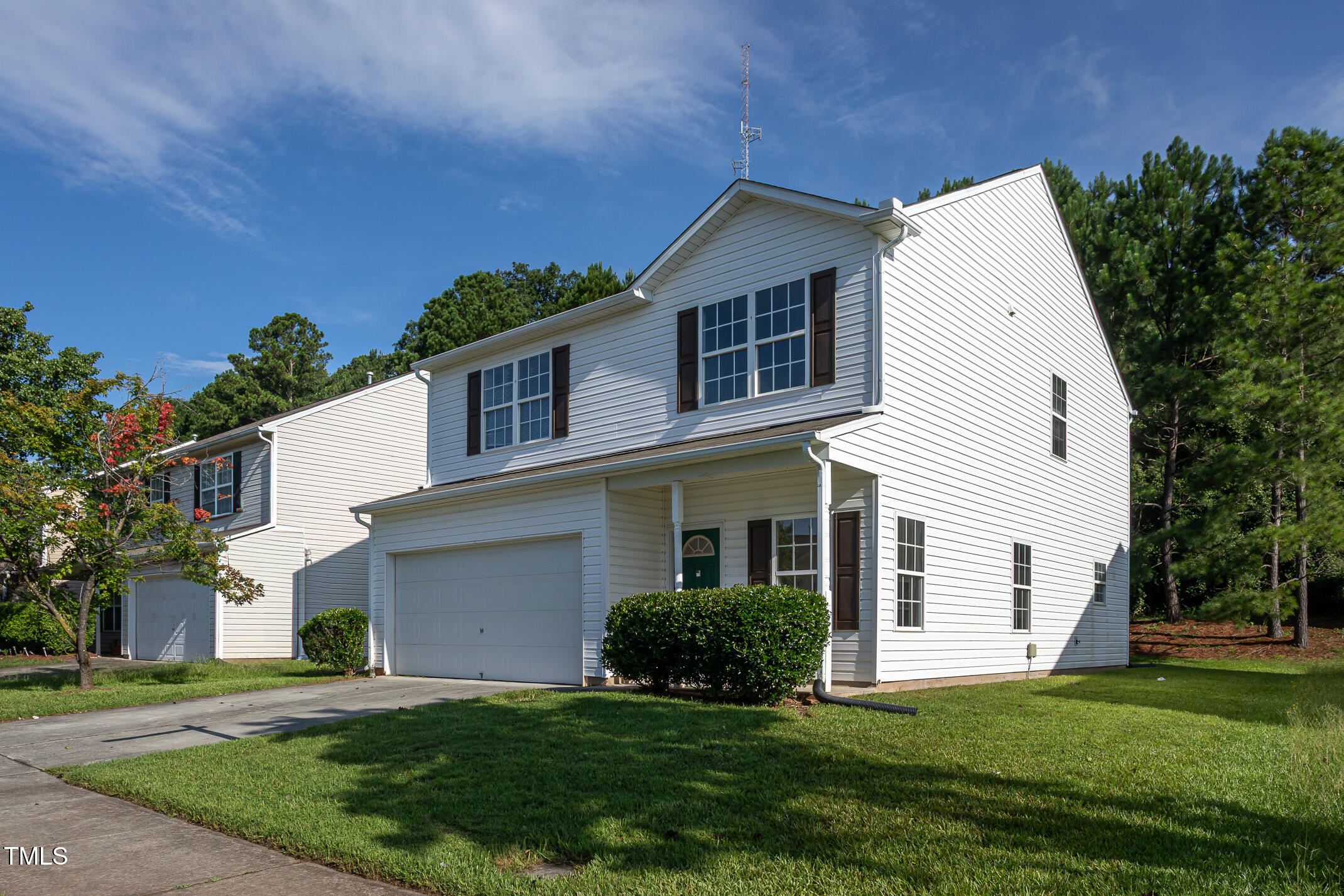 601 Weeping Willow Drive Durham, NC 27704 - Photo 26 of 36 a front view of a house with a yard