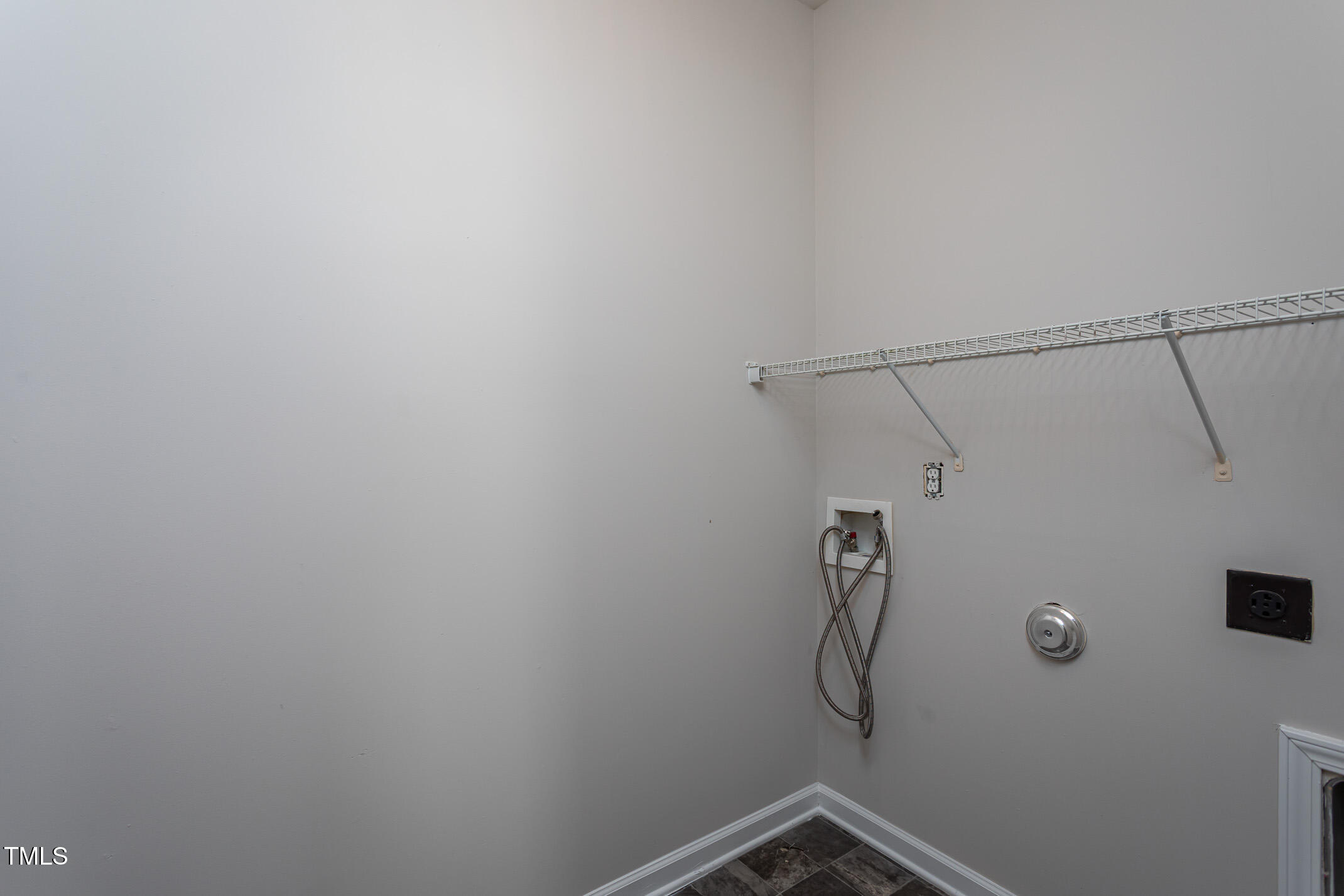 601 Weeping Willow Drive Durham, NC 27704 - Photo 29 of 36 a view of a room with racks on the wall