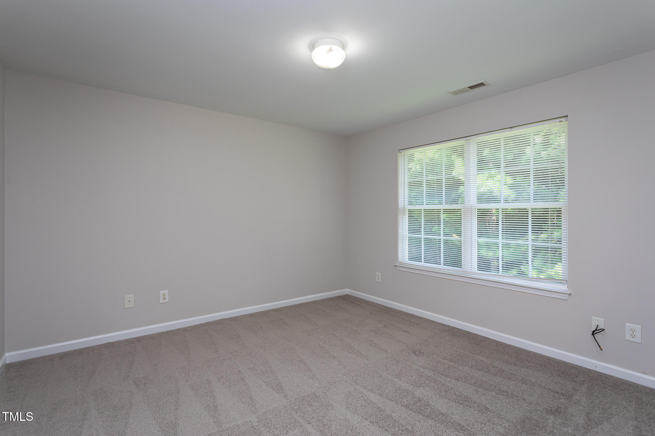 601 Weeping Willow Drive Durham, NC 27704 - Photo 30 of 36 an empty room with a window