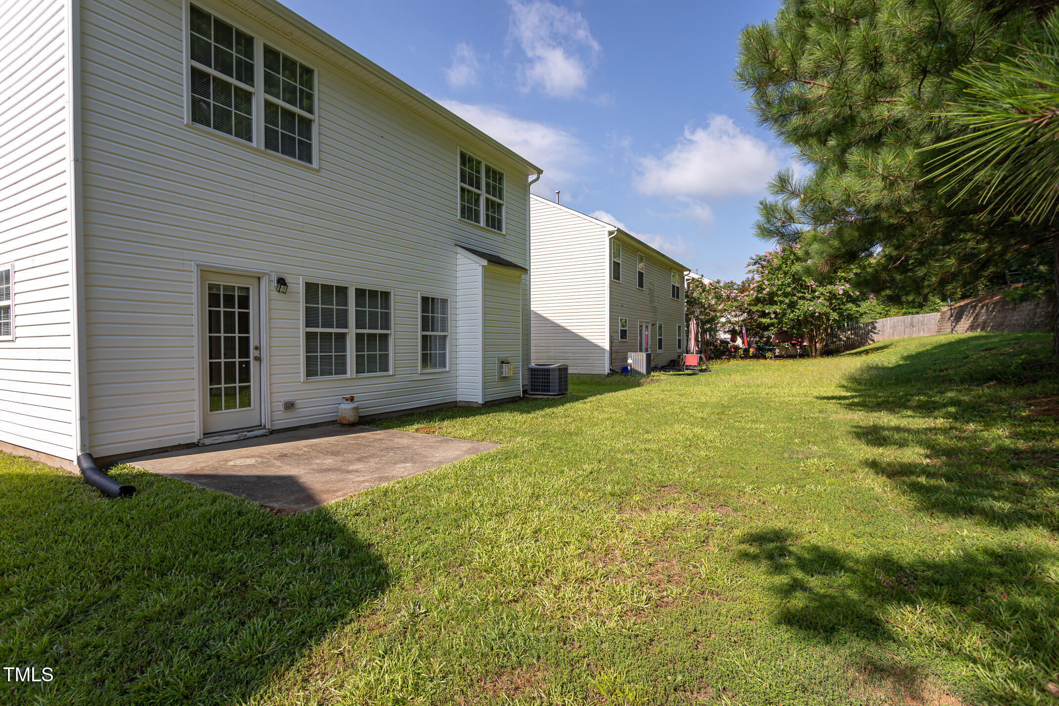 601 Weeping Willow Drive Durham, NC 27704 - Photo 33 of 36 a view of a house with a yard and garage