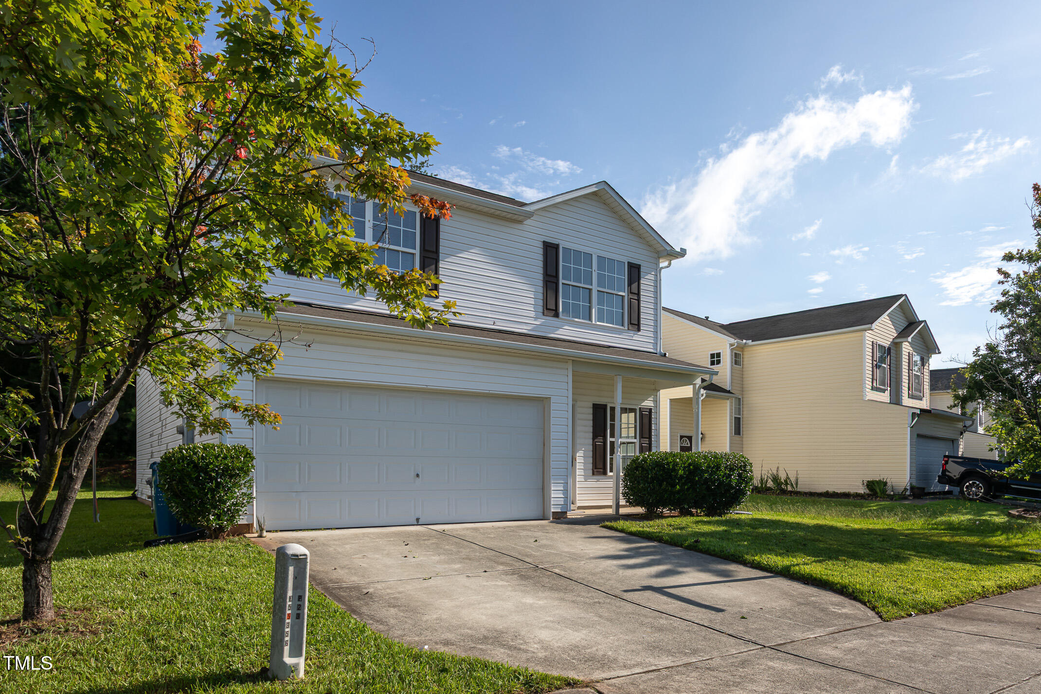 601 Weeping Willow Drive Durham, NC 27704 - Photo 35 of 36 a front view of a house with a yard and garage