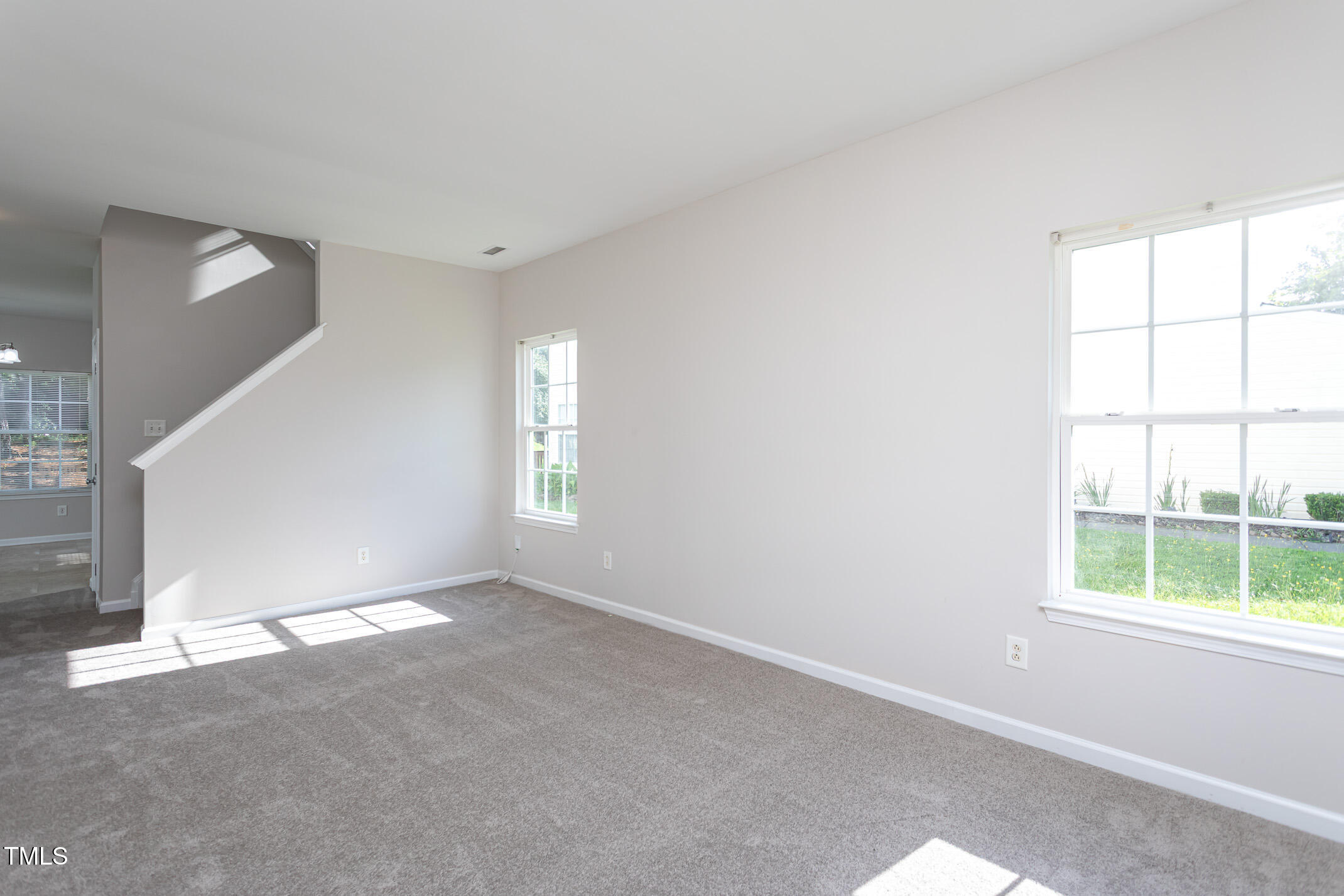 601 Weeping Willow Drive Durham, NC 27704 - Photo 9 of 36 an empty room with windows
