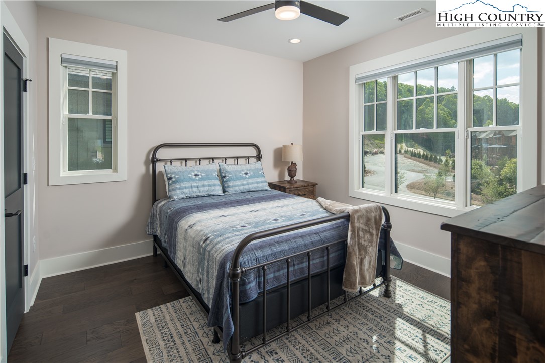 103 Dugger Rdg Trail Boone, NC 28607 - Photo 21 of 49 a bedroom with a bed a window and potted plant on the dresser