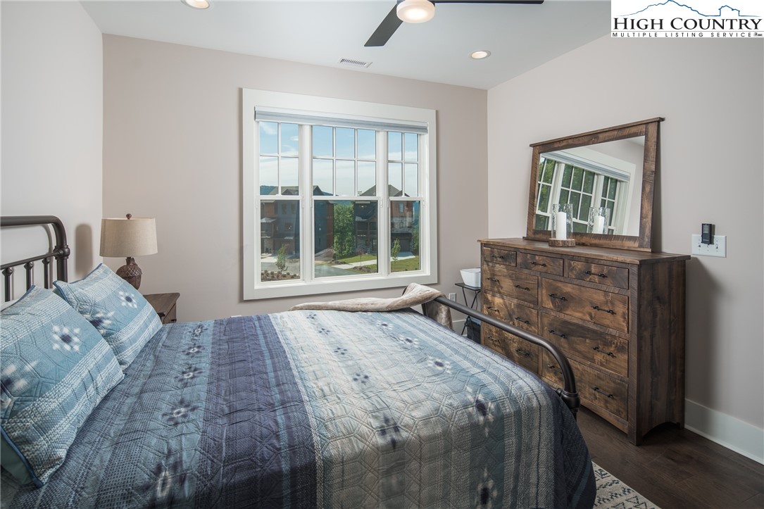 103 Dugger Rdg Trail Boone, NC 28607 - Photo 22 of 49 a bedroom with a bed and a large window