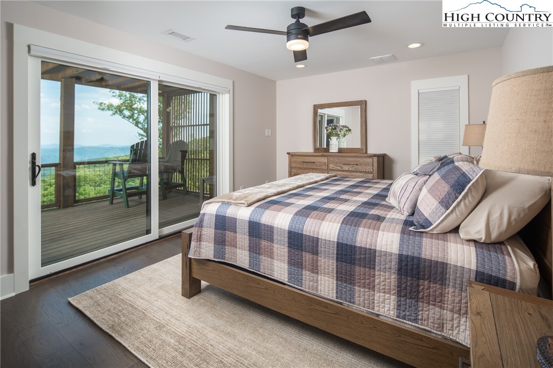 103 Dugger Rdg Trail Boone, NC 28607 - Photo 25 of 49 a bedroom with a bed and large window
