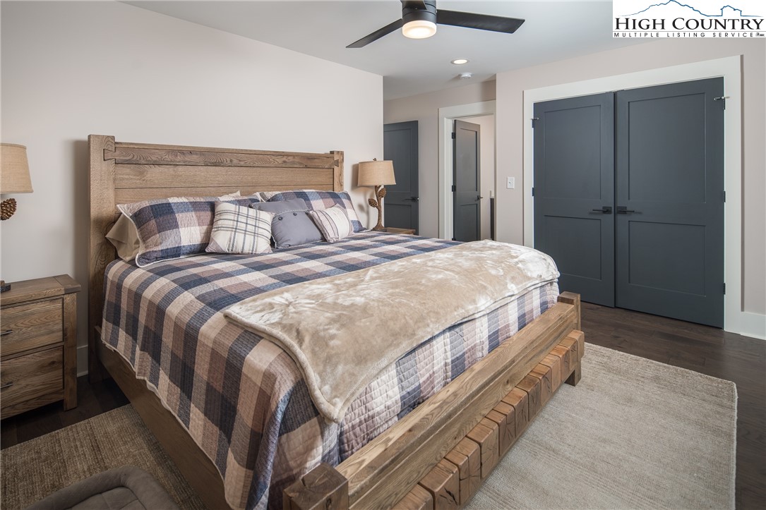 103 Dugger Rdg Trail Boone, NC 28607 - Photo 26 of 49 a bedroom with a bed and a chandelier