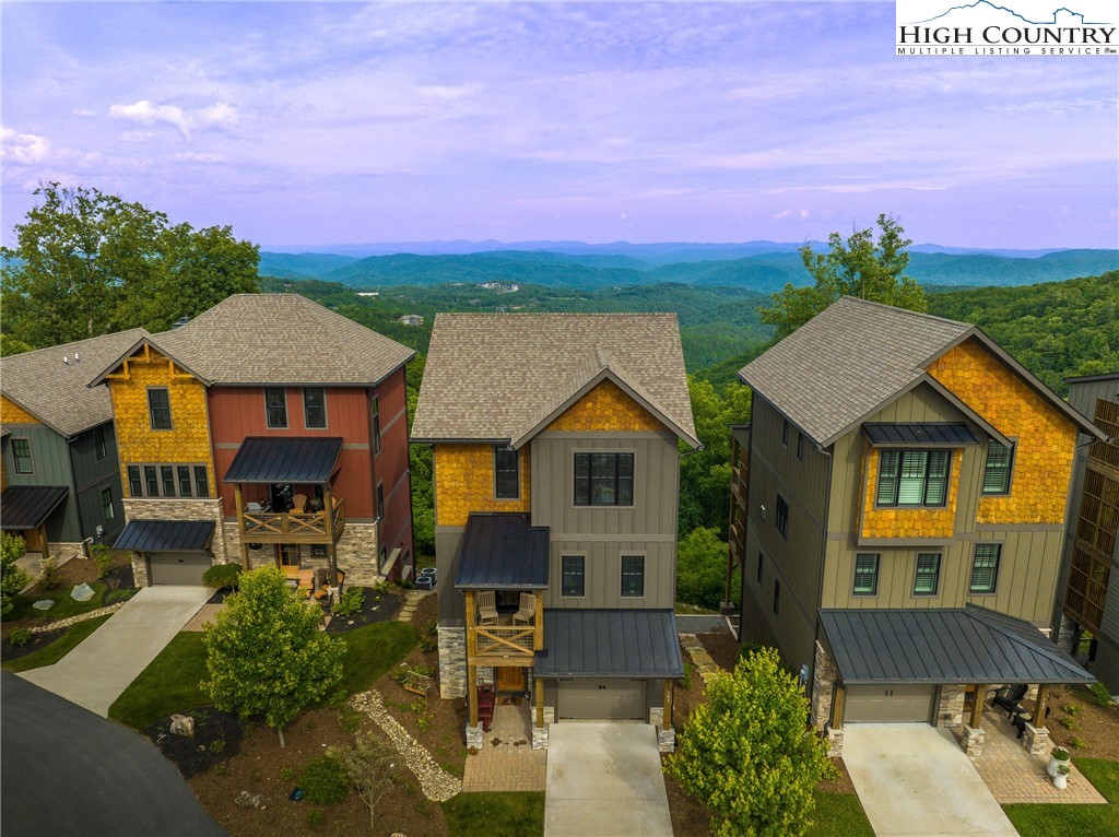 103 Dugger Rdg Trail Boone, NC 28607 - Photo 30 of 49 a front view of a house with a yard and garage