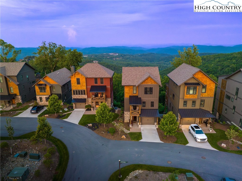 103 Dugger Rdg Trail Boone, NC 28607 - Photo 33 of 49 a view of multiple houses with a yard