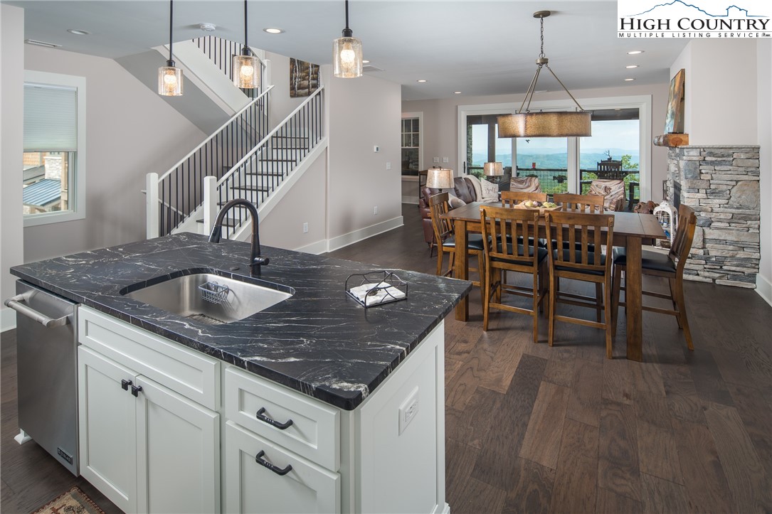 103 Dugger Rdg Trail Boone, NC 28607 - Photo 7 of 49 a kitchen with lots of counter furniture a sink and appliances